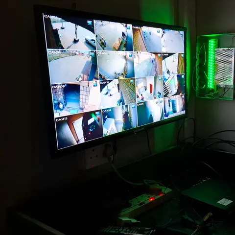 A monitor showing a grid of CCTV camera views